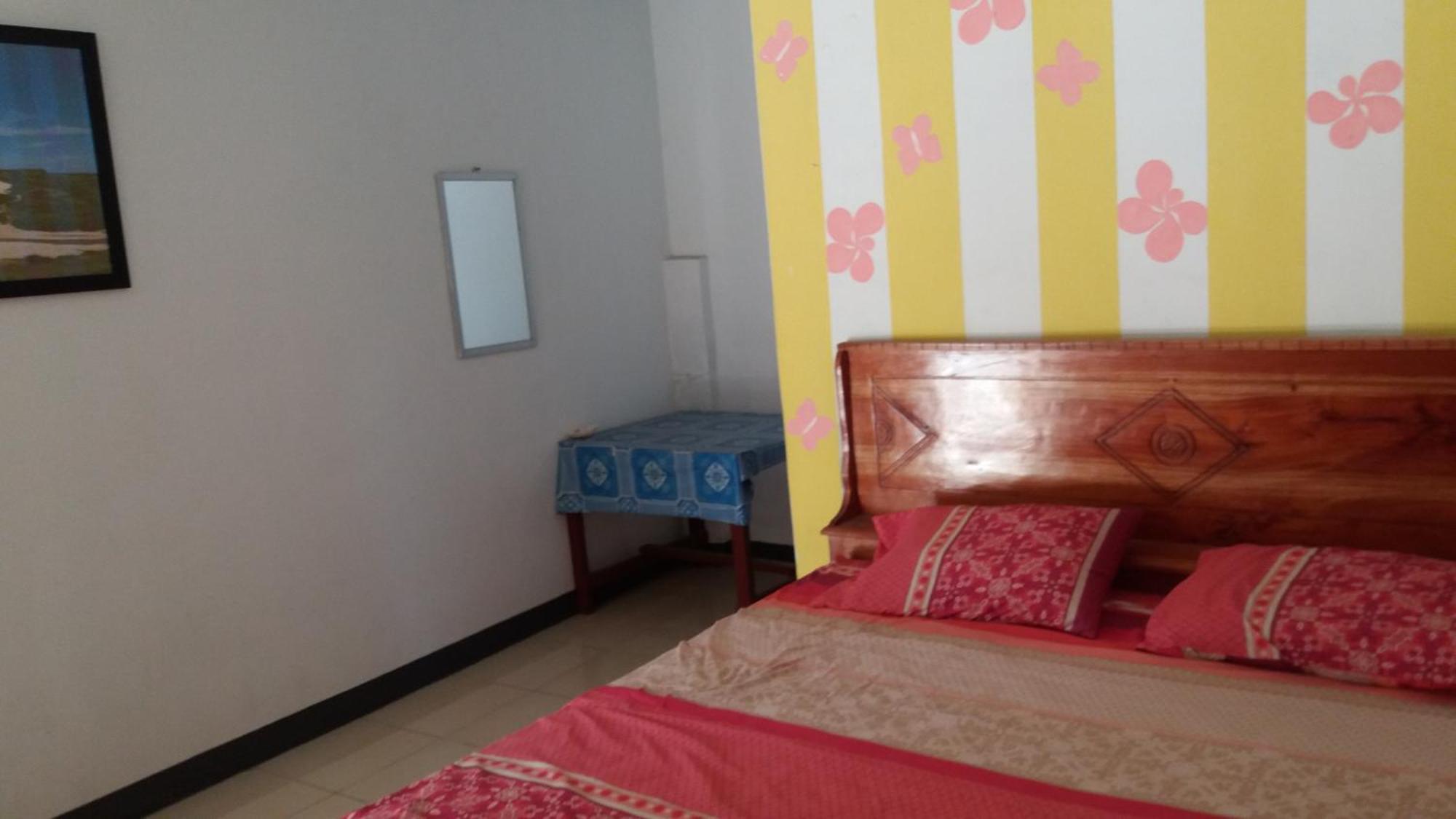 Ekas Beach Guesthouse Mitra Reddoorz الغرفة الصورة